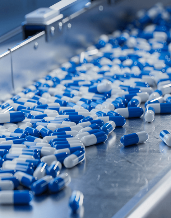 Pharmaceuticals being manufactured on machinery  