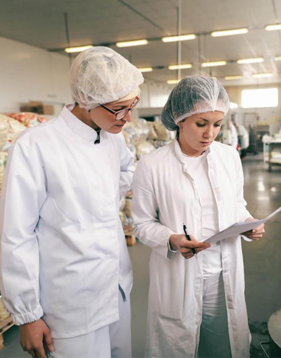 Food safety technicians working in a distribution warehouse