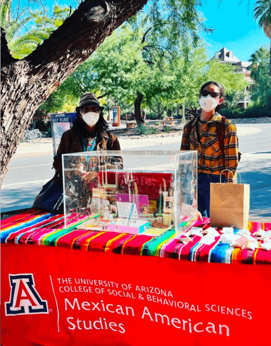 Students in UArizona's Mexican American Studies program displaying Mexican textiles